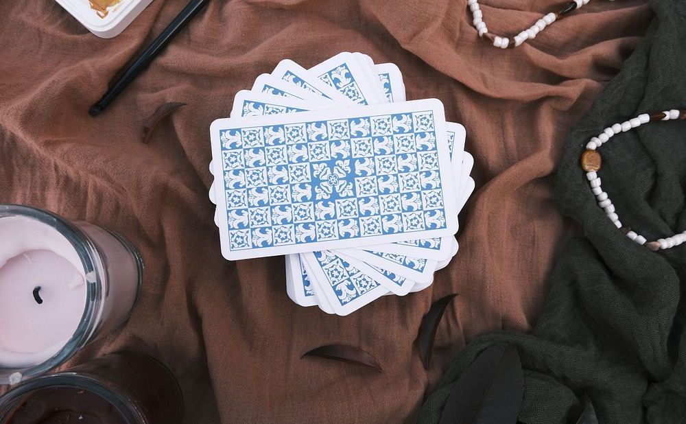 Tarot cards and candle arranged for a reading